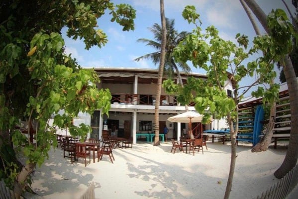 Cokes Surf Camp open-air dining and palm garden, Thulusdhoo