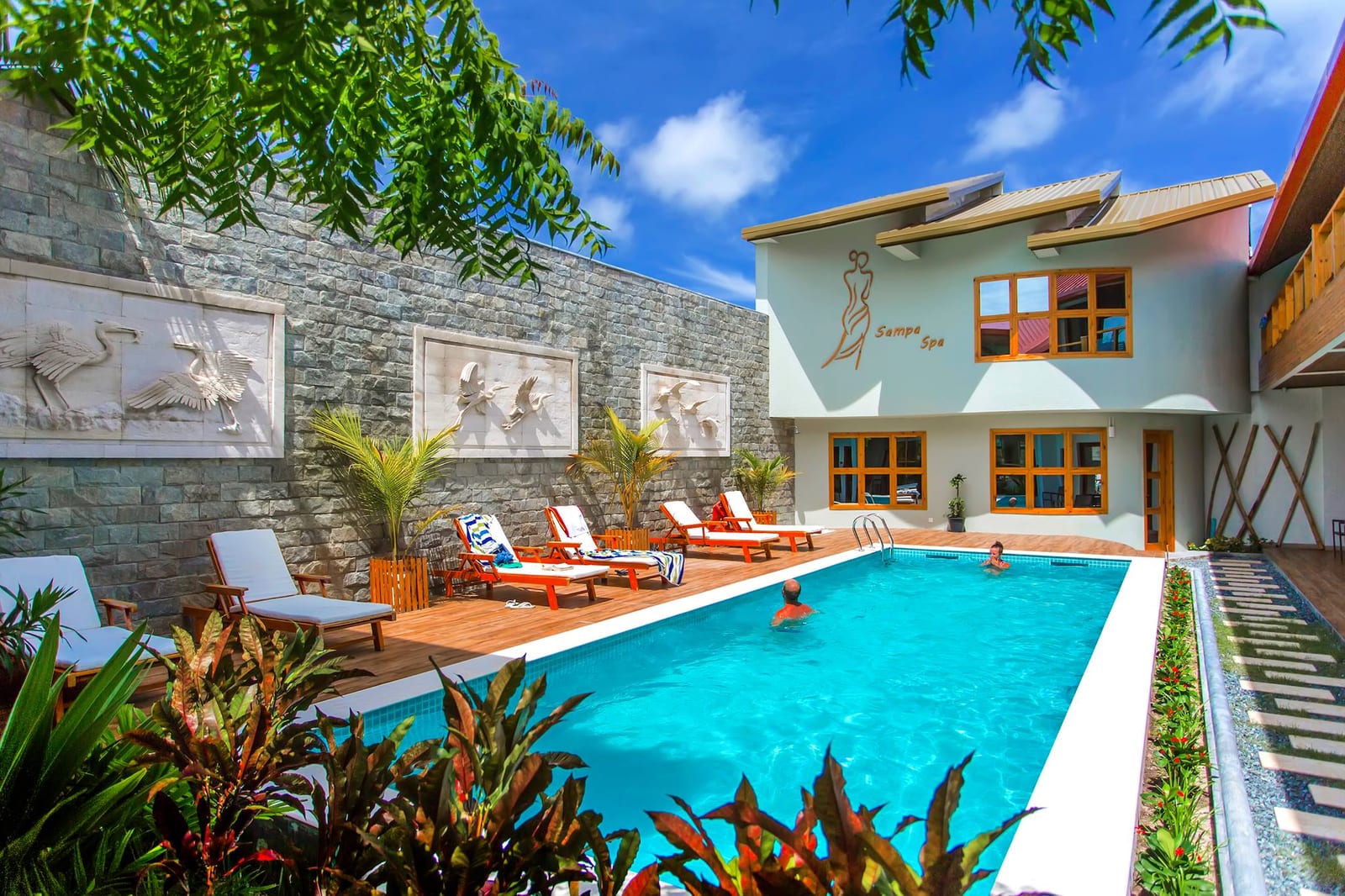 Kaani Village & Spa pool deck and palm courtyard, Maafushi