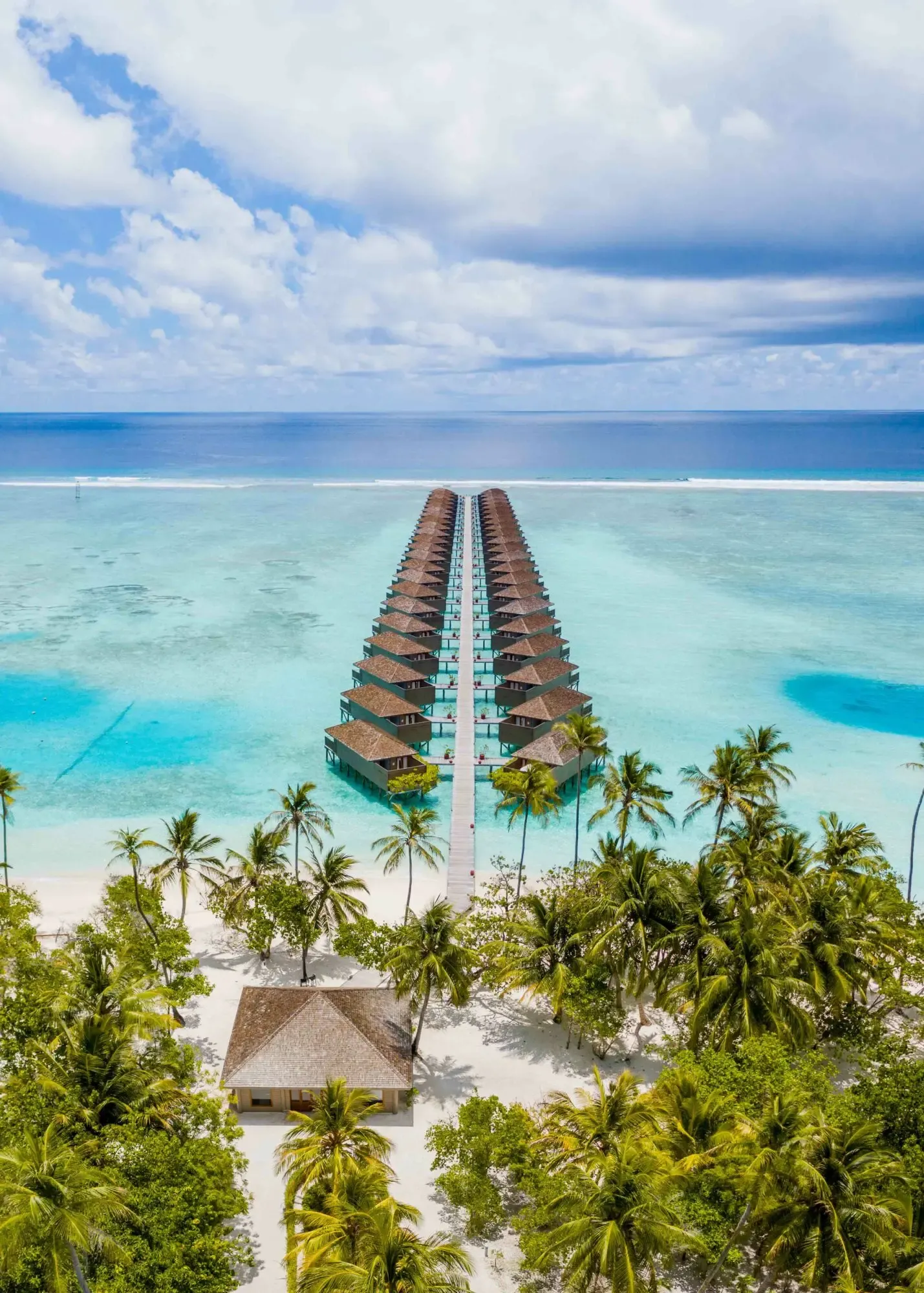 Aerial of Meeru island showing the long curve of beach villas