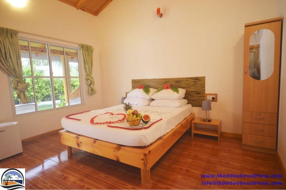 Thoddoo Beach View facade with palm garden